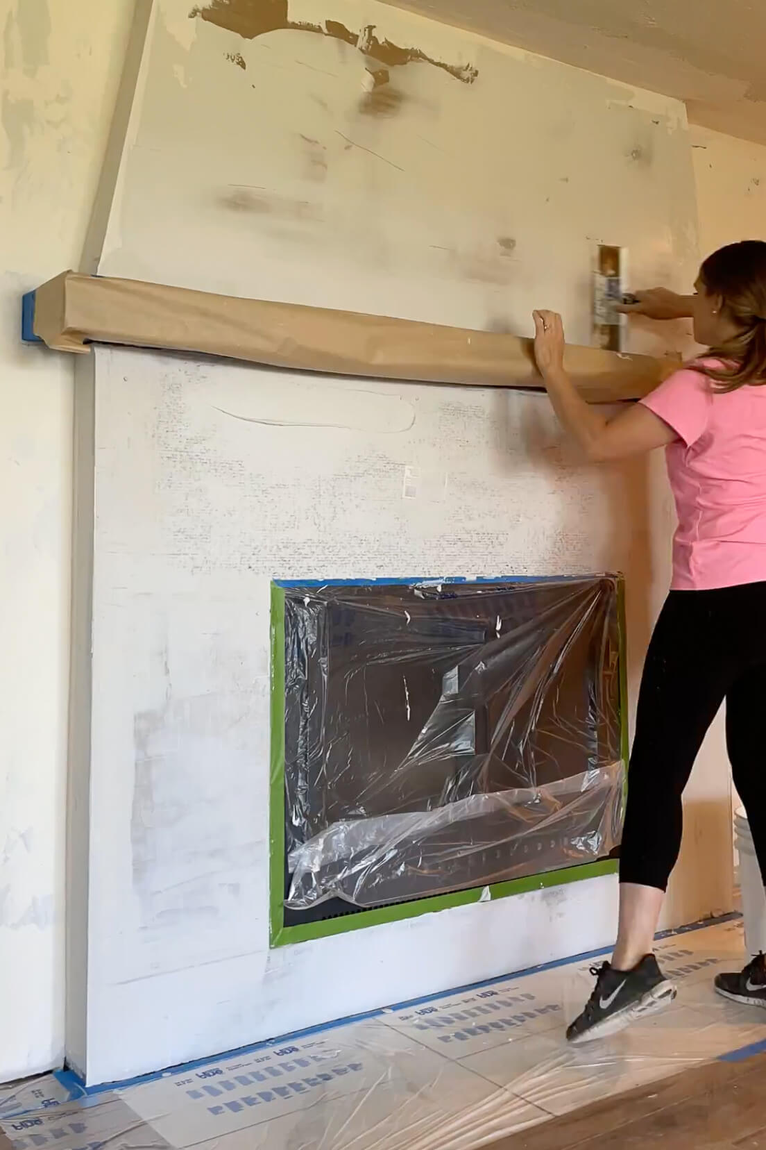 Using featherweight cement to coat a fireplace.